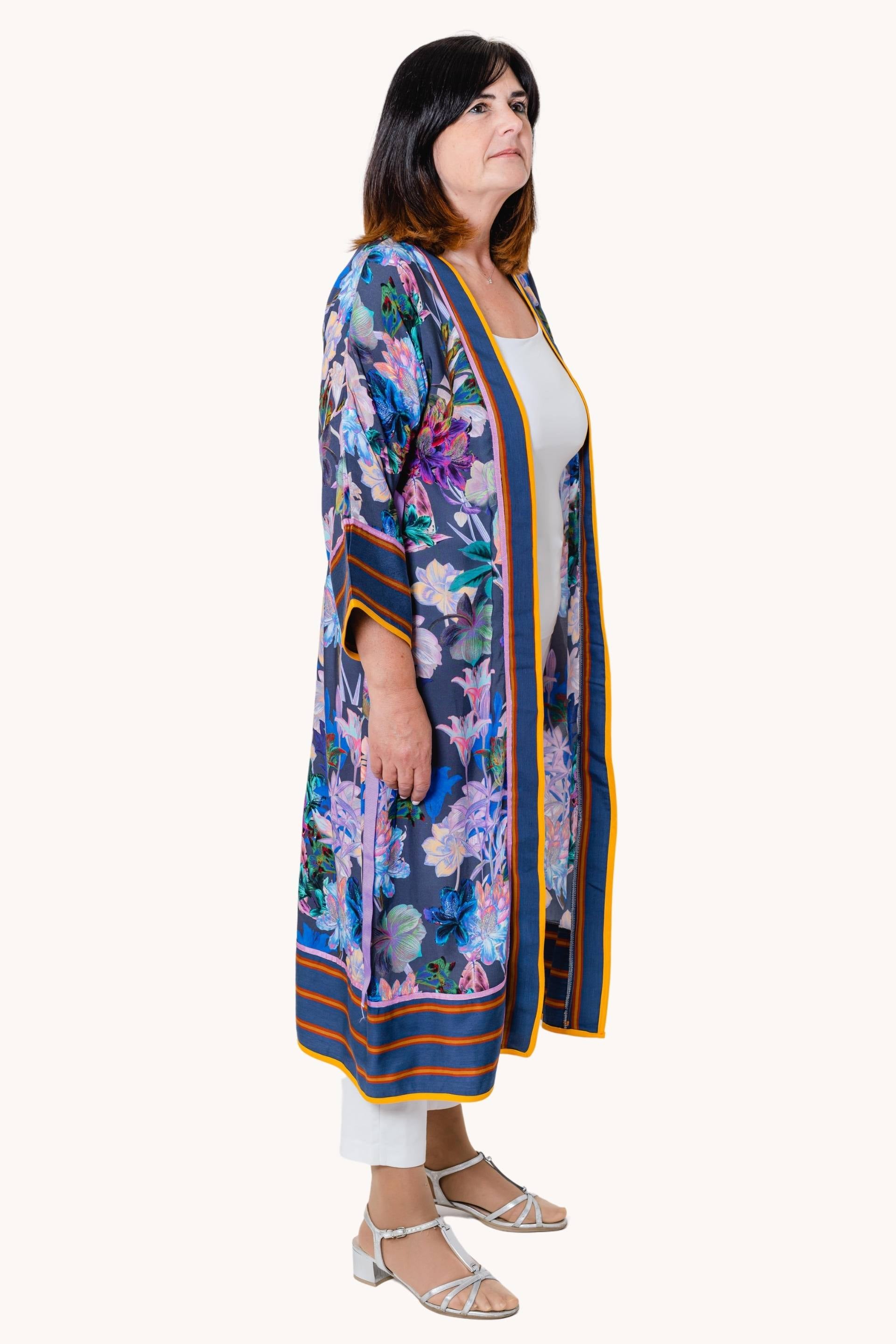 Dorsalis long kimono featuring floral motifs and striped cotton fabrics, elegantly draped on a mannequin.