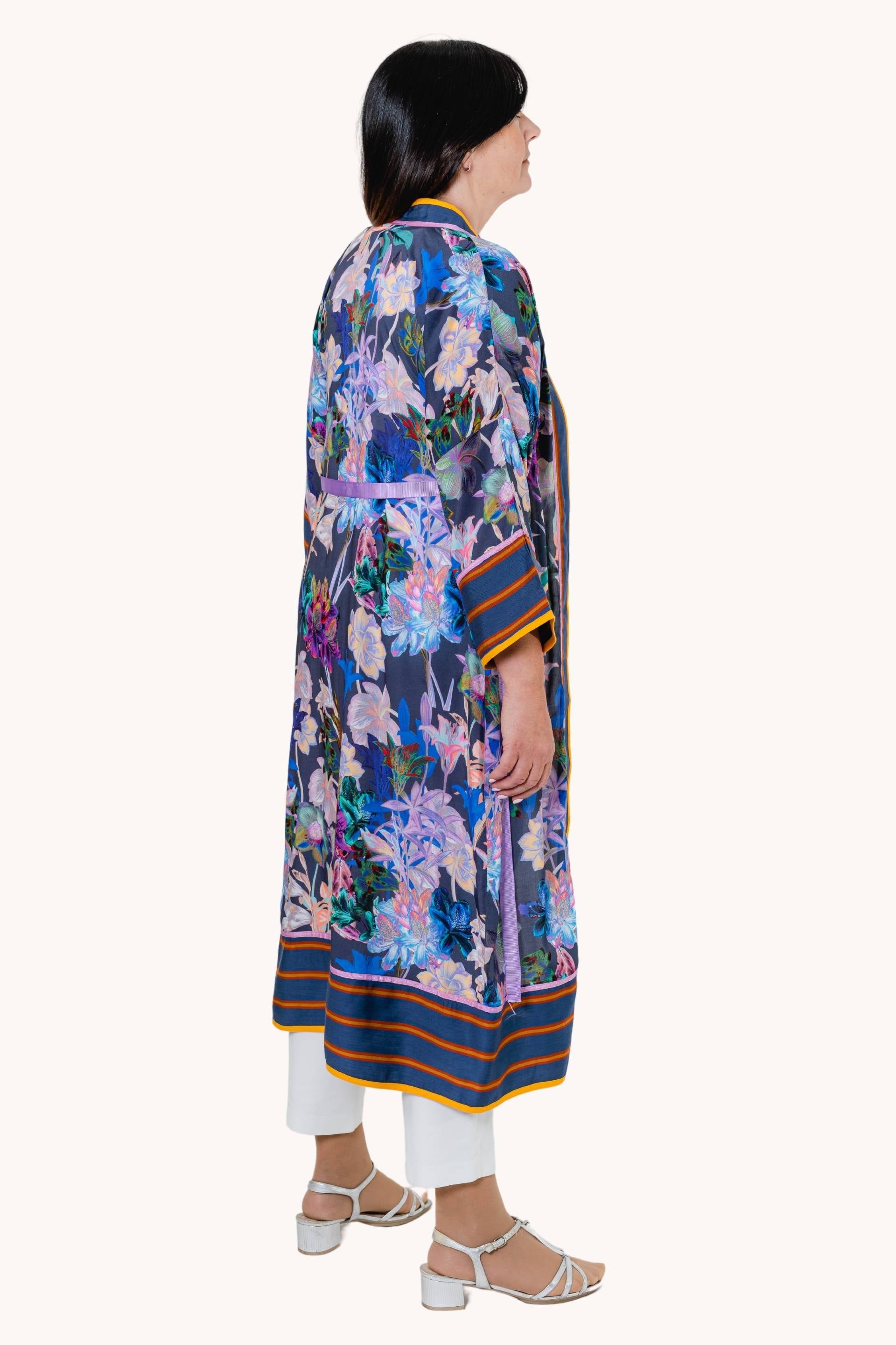 Dorsalis long kimono featuring floral motifs and striped cotton fabrics, elegantly draped on a mannequin.