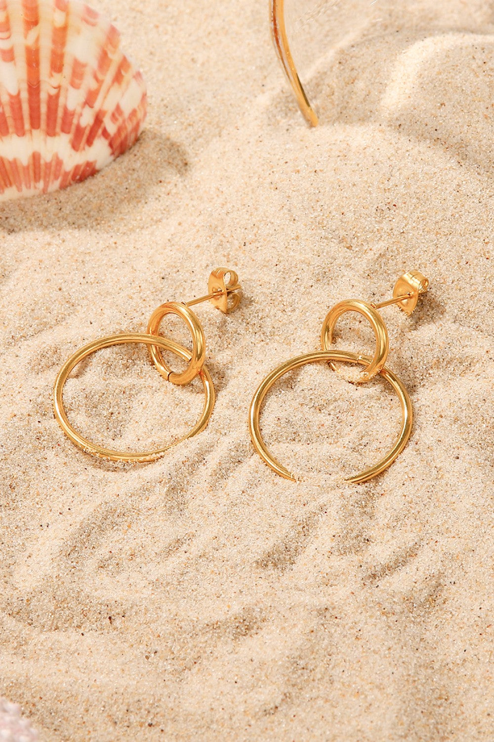 Elegant Double Hoop Drop Earrings in gold-plated stainless steel, showcasing their unique design and lightweight structure.