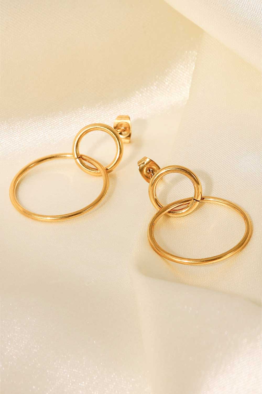 Elegant Double Hoop Drop Earrings in gold-plated stainless steel, showcasing their unique design and lightweight structure.