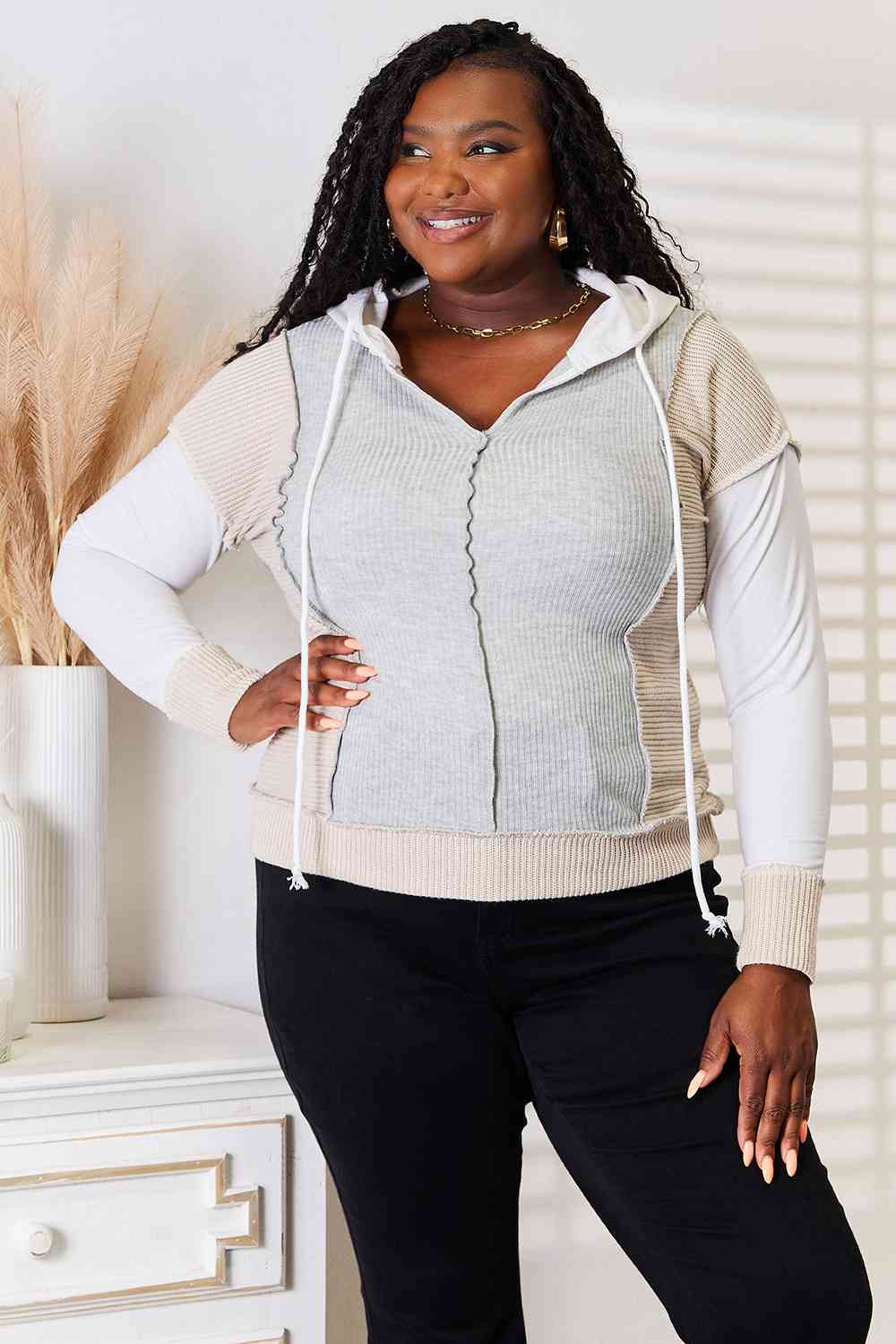 Double Take Color Block Exposed Seam Drawstring Hoodie featuring trendy color blocks and exposed seams, perfect for casual wear.