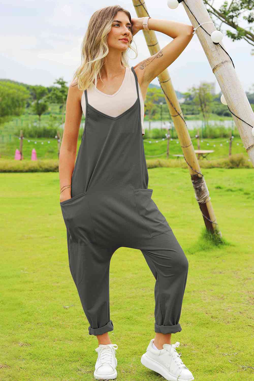 Double Take Full Size Sleeveless V-Neck Pocketed Jumpsuit in a stylish design, showcasing its V-neckline and side pockets.