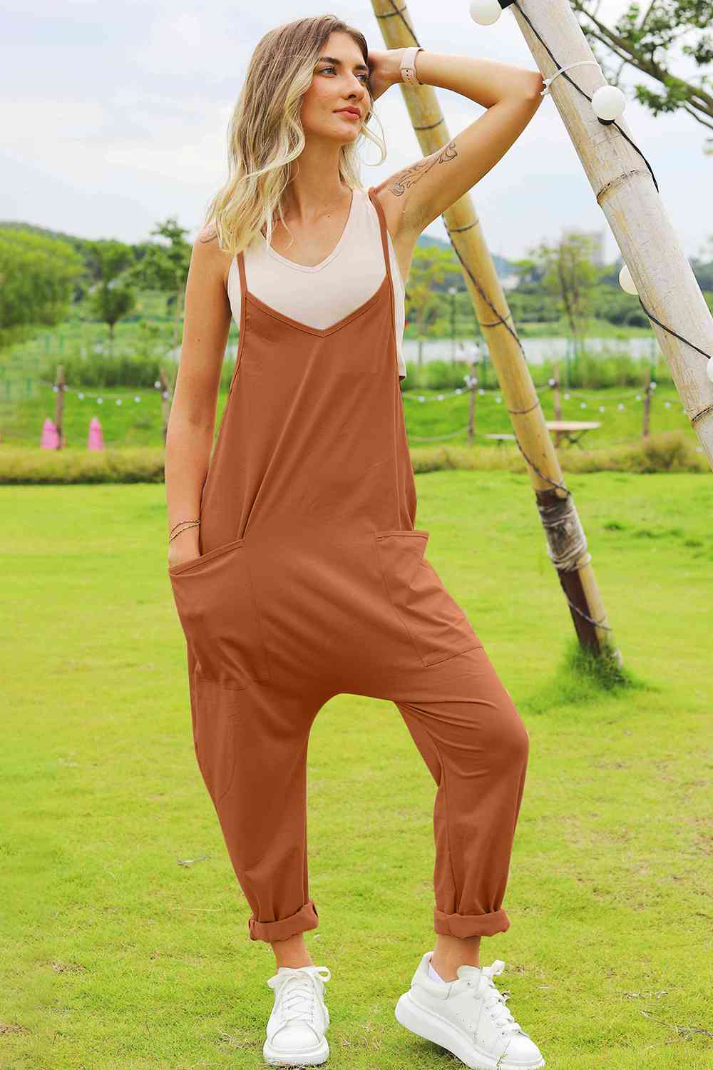 Double Take Full Size Sleeveless V-Neck Pocketed Jumpsuit in a stylish design, showcasing its V-neckline and side pockets.