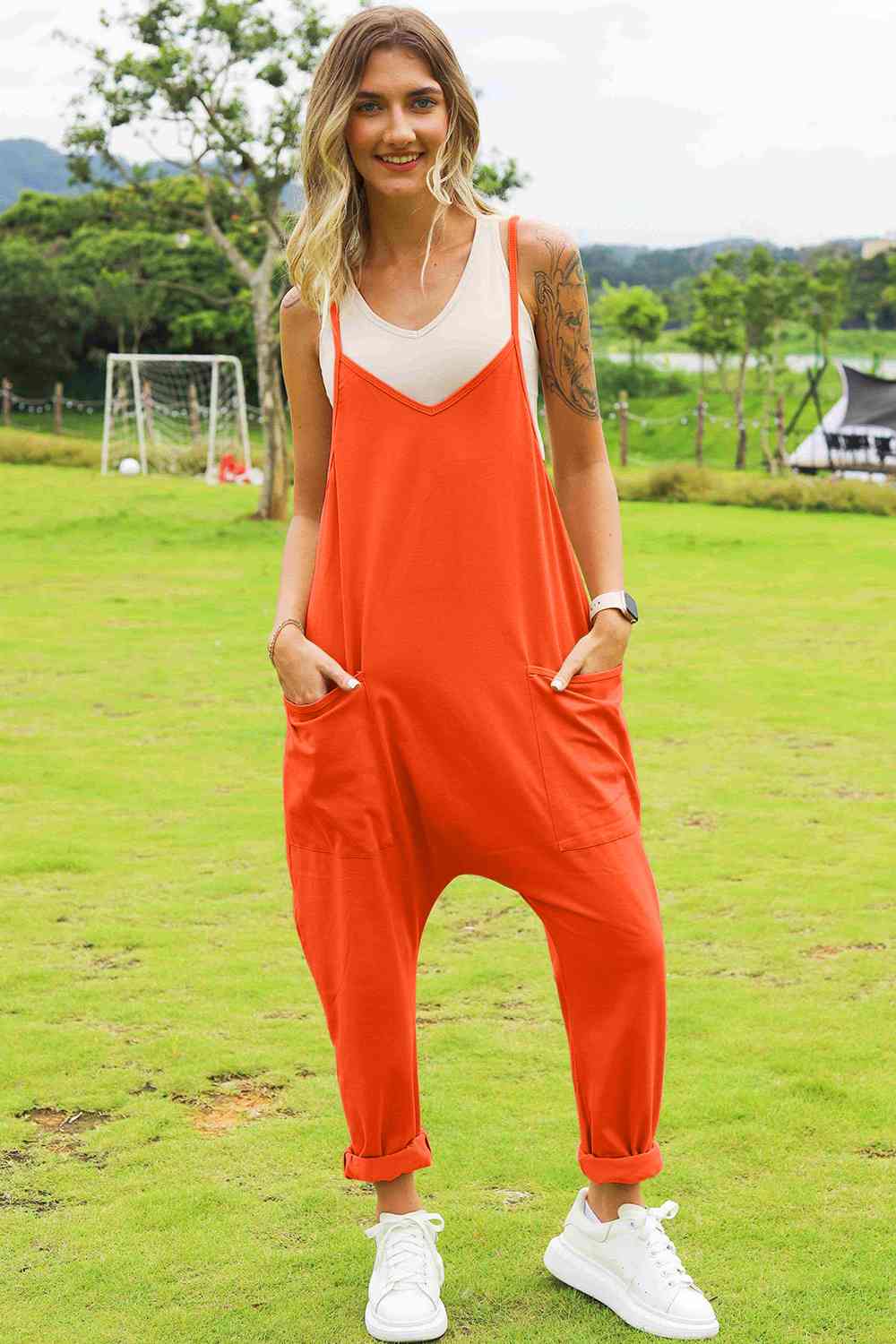 Double Take Full Size Sleeveless V-Neck Pocketed Jumpsuit in a stylish design, showcasing its V-neckline and side pockets.