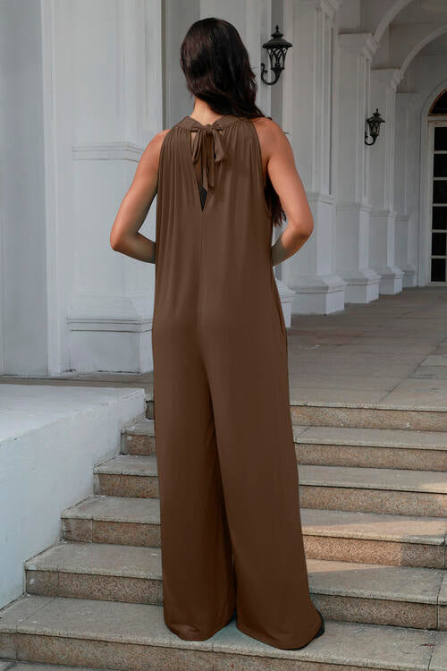 Double Take Full Size Tie Back Cutout Sleeveless Jumpsuit showcasing its stylish design and comfortable fabric.