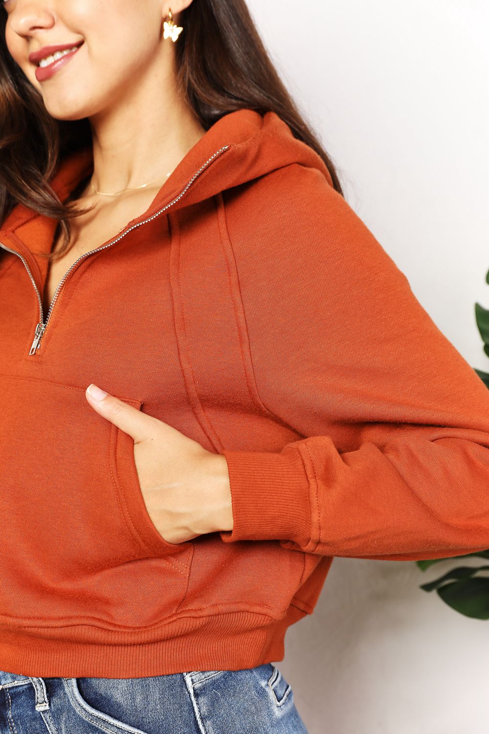 Double Take Half-Zip Long Sleeve Hoodie in solid color with ribbed details and long sleeves.