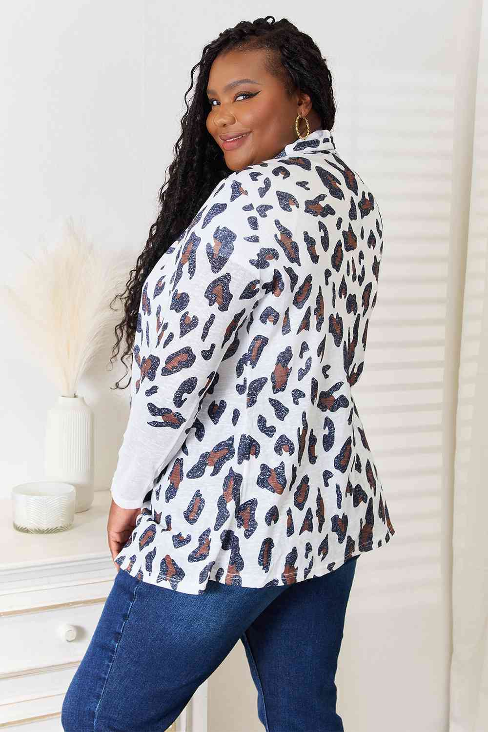 Double Take Leopard Long Sleeve Cardigan featuring bold leopard print and long sleeves, perfect for layering.