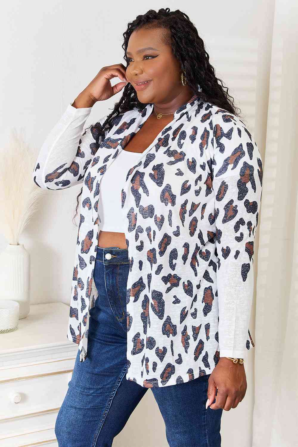 Double Take Leopard Long Sleeve Cardigan featuring bold leopard print and long sleeves, perfect for layering.