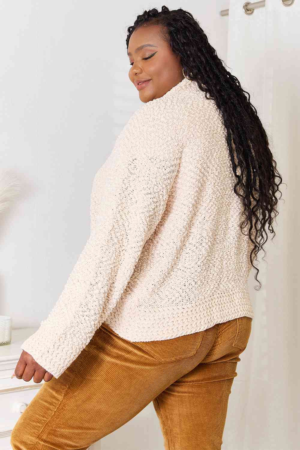 A cozy Double Take Open Front Long Sleeve Cardigan in a neutral color, showcasing its open front design and long sleeves.