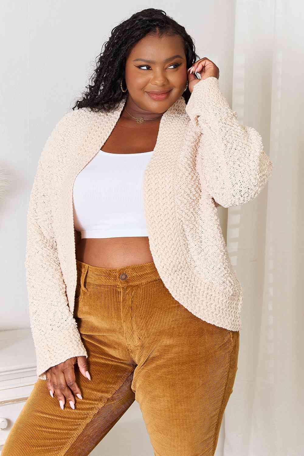 A cozy Double Take Open Front Long Sleeve Cardigan in a neutral color, showcasing its open front design and long sleeves.