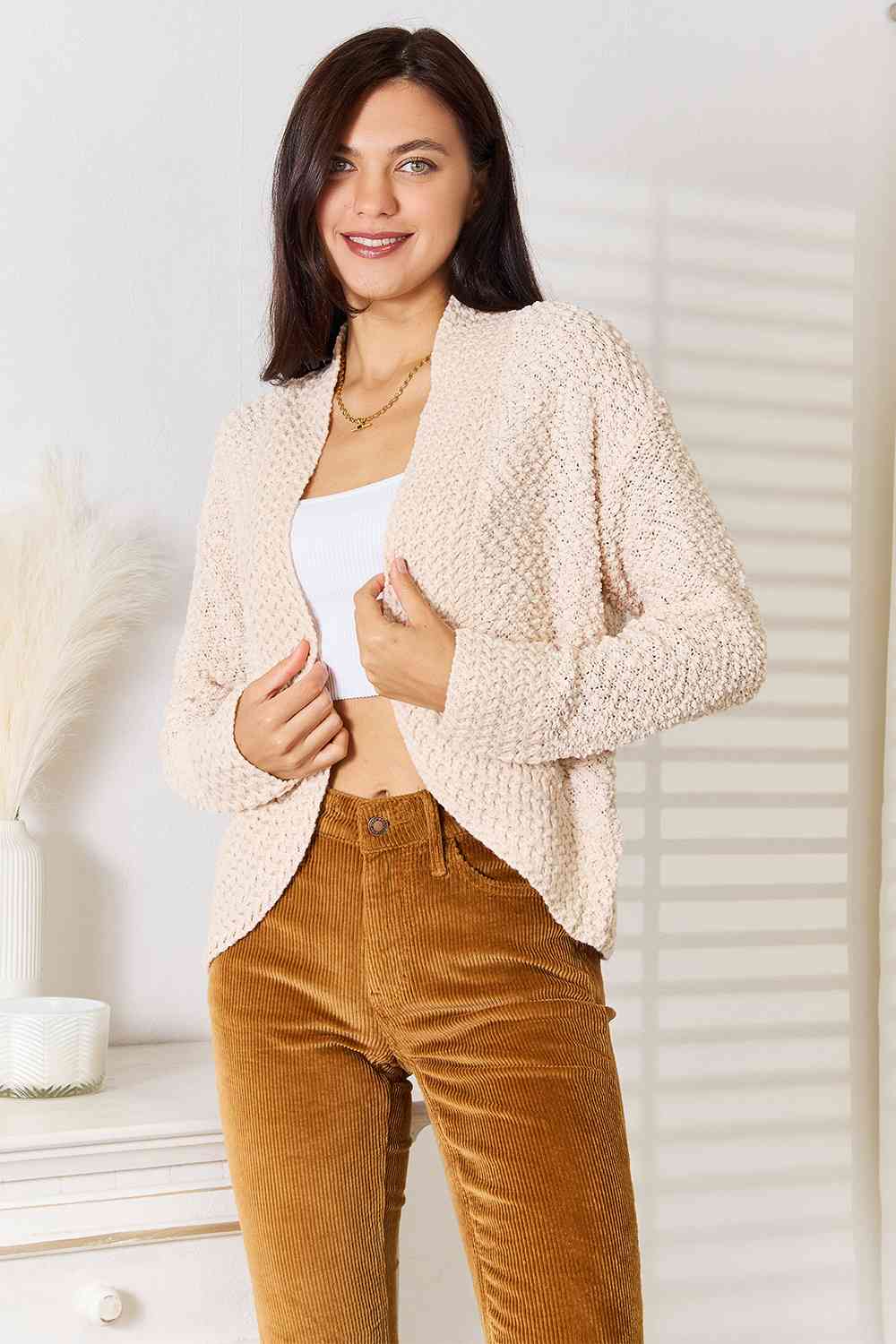 A cozy Double Take Open Front Long Sleeve Cardigan in a neutral color, showcasing its open front design and long sleeves.