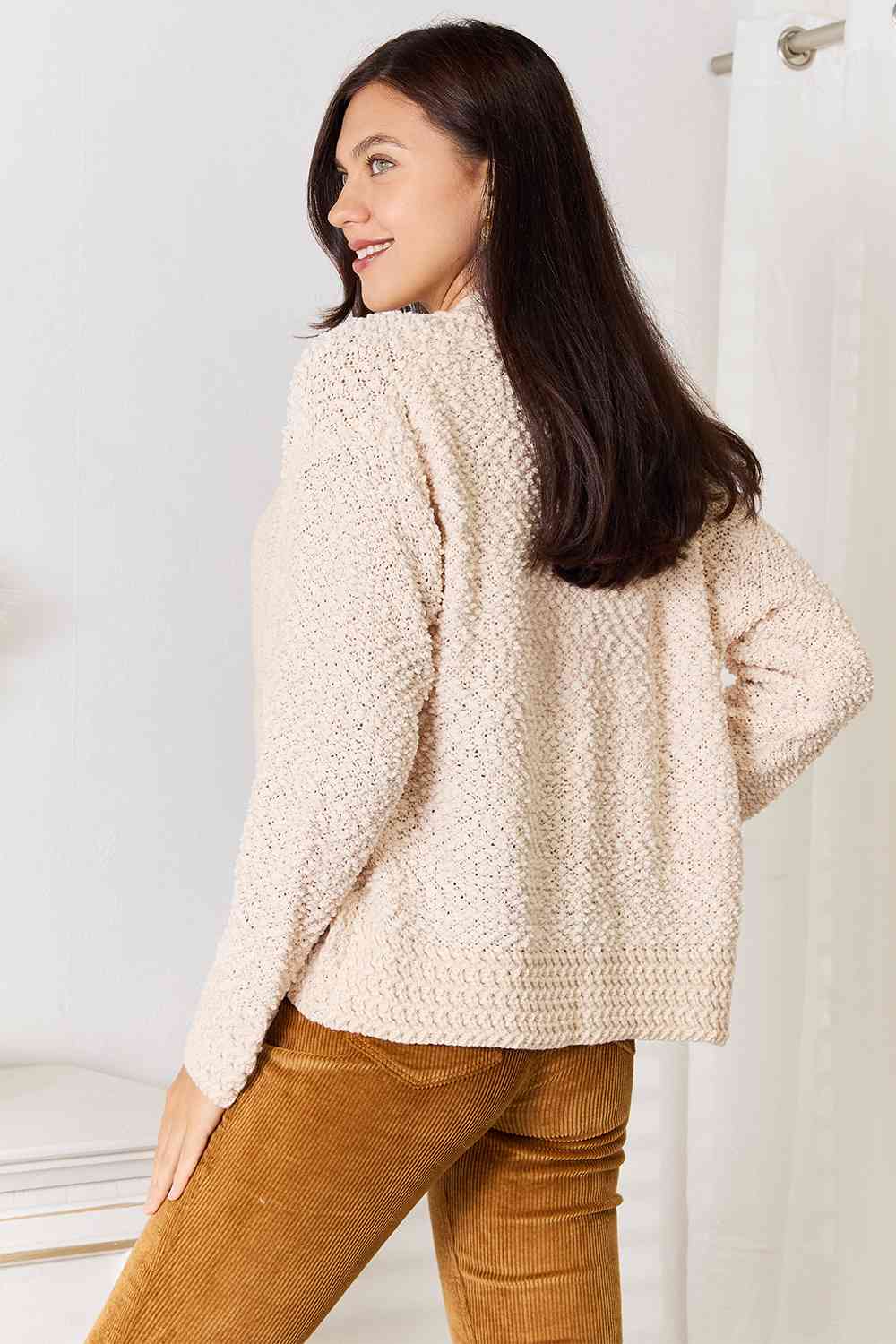 A cozy Double Take Open Front Long Sleeve Cardigan in a neutral color, showcasing its open front design and long sleeves.