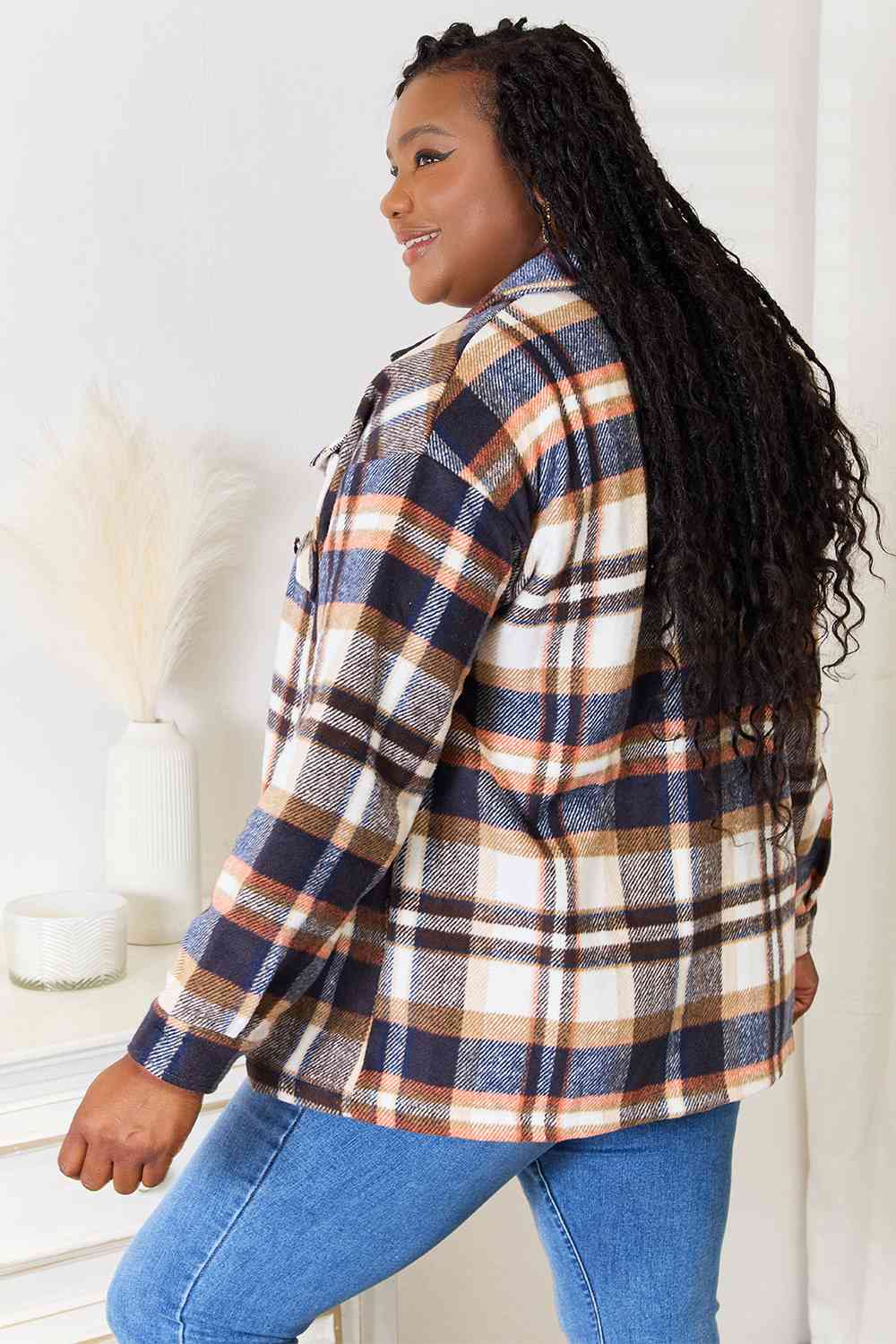 Double Take Plaid Button Front Shirt Jacket featuring breast pockets and long sleeves, styled for a casual look.