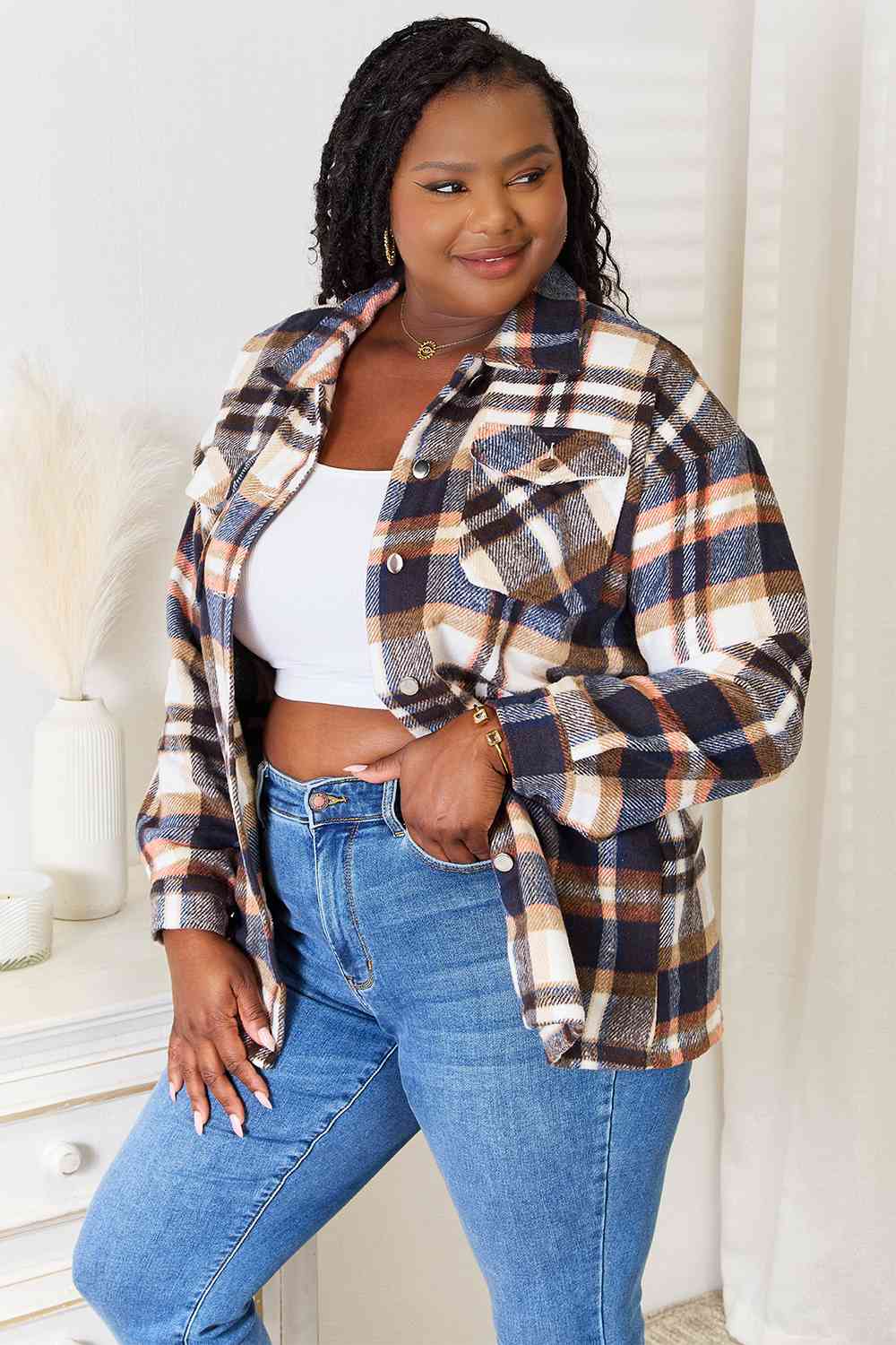 Double Take Plaid Button Front Shirt Jacket featuring breast pockets and long sleeves, styled for a casual look.