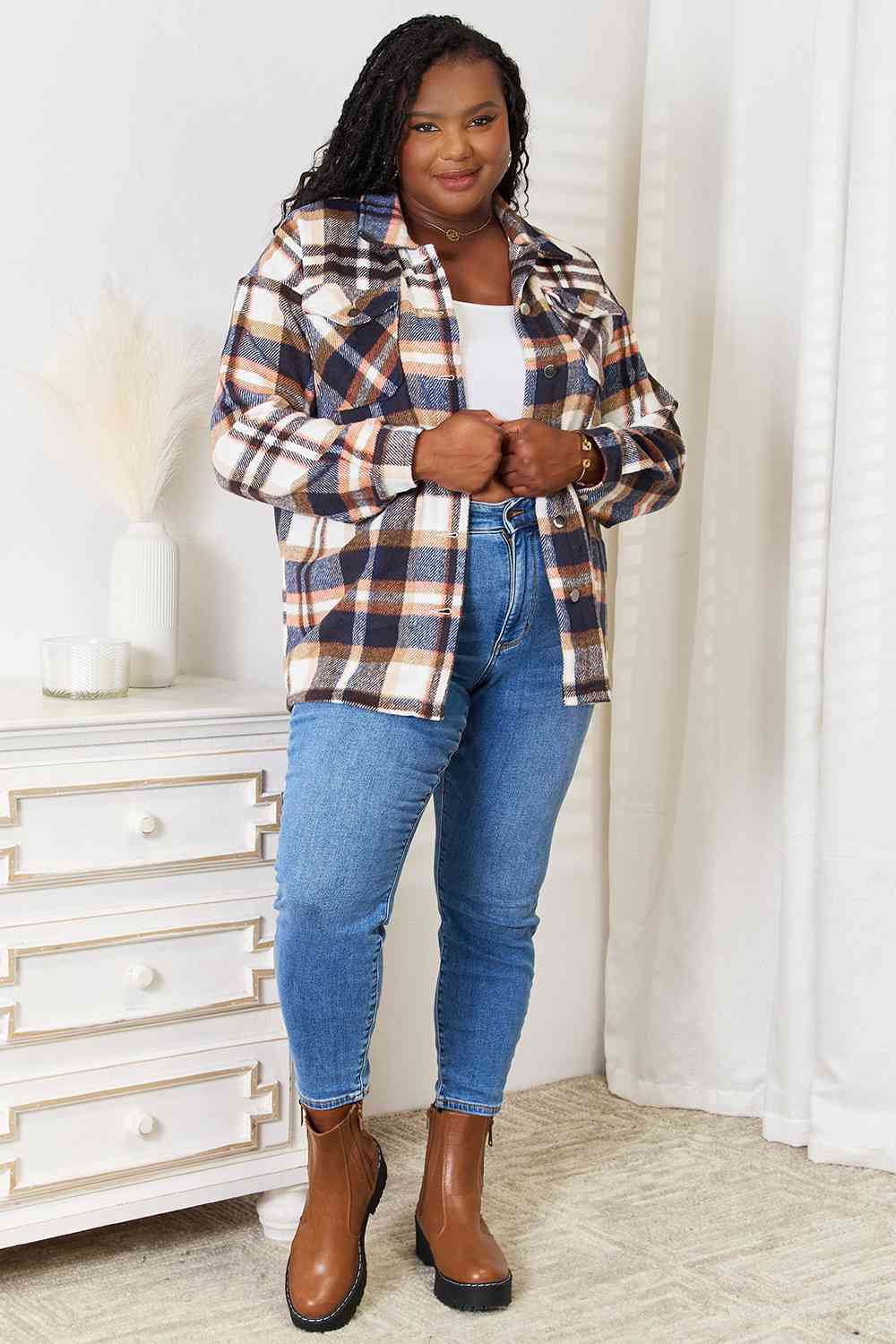 Double Take Plaid Button Front Shirt Jacket featuring breast pockets and long sleeves, styled for a casual look.