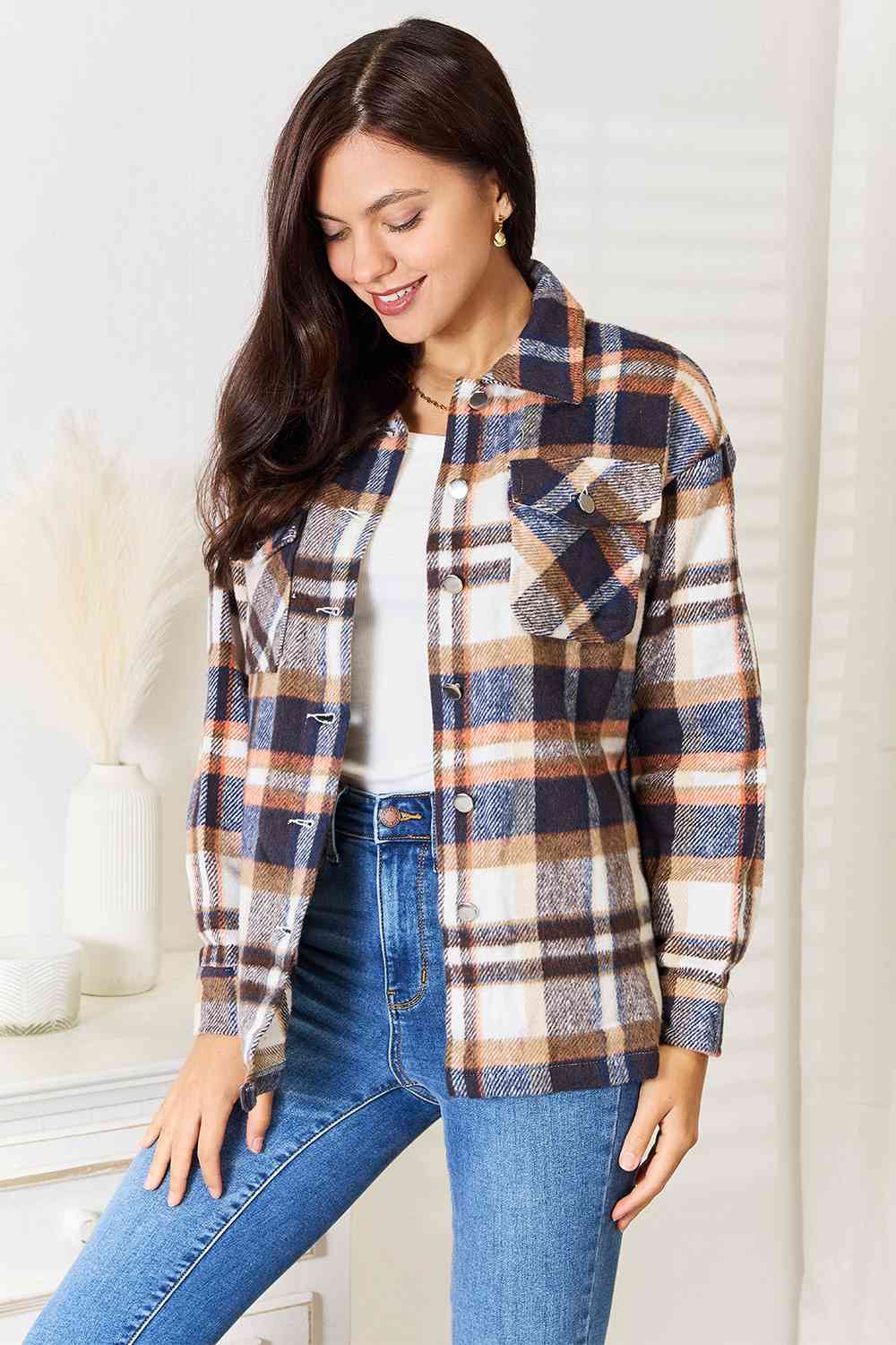 Double Take Plaid Button Front Shirt Jacket featuring breast pockets and long sleeves, styled for a casual look.