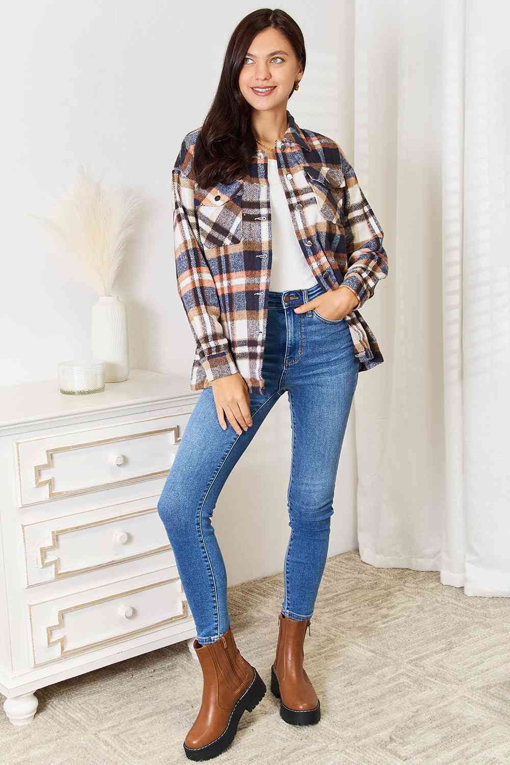 Double Take Plaid Button Front Shirt Jacket featuring breast pockets and long sleeves, styled for a casual look.