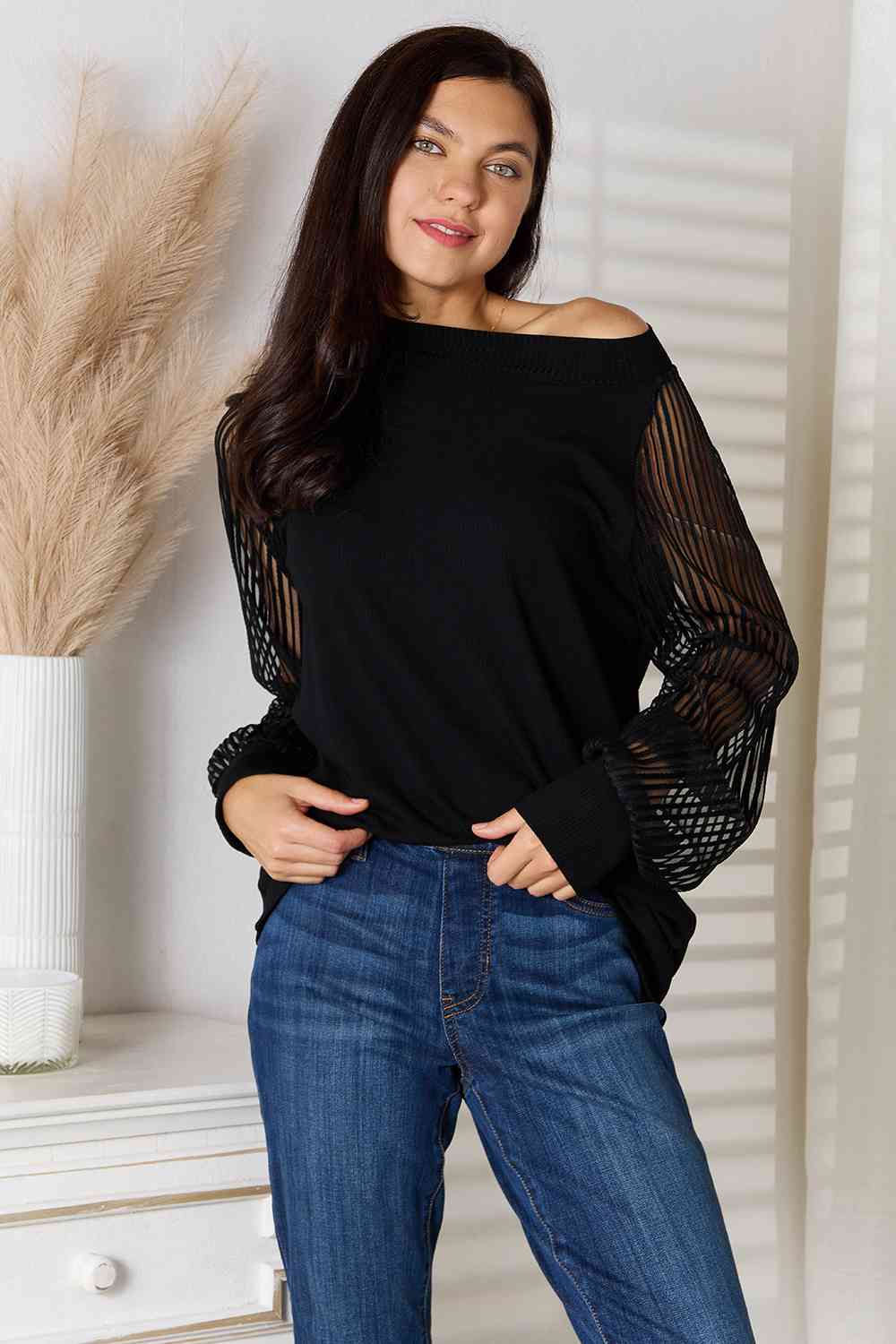 Double Take Round Neck Raglan Sleeve Blouse featuring a classic round neckline and comfortable raglan sleeves in a semi-sheer fabric.