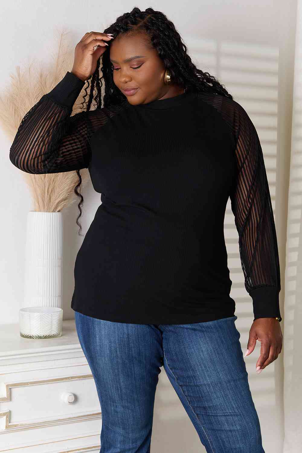 Double Take Round Neck Raglan Sleeve Blouse featuring a classic round neckline and comfortable raglan sleeves in a semi-sheer fabric.