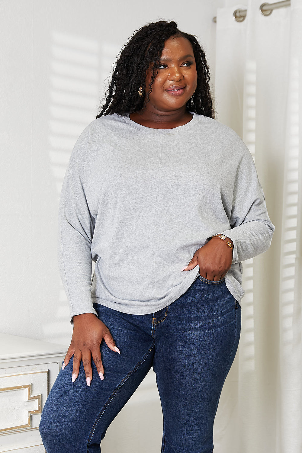 Double Take Seam Detail Round Neck Long Sleeve Top in a stylish design, showcasing seam details and a round neckline.