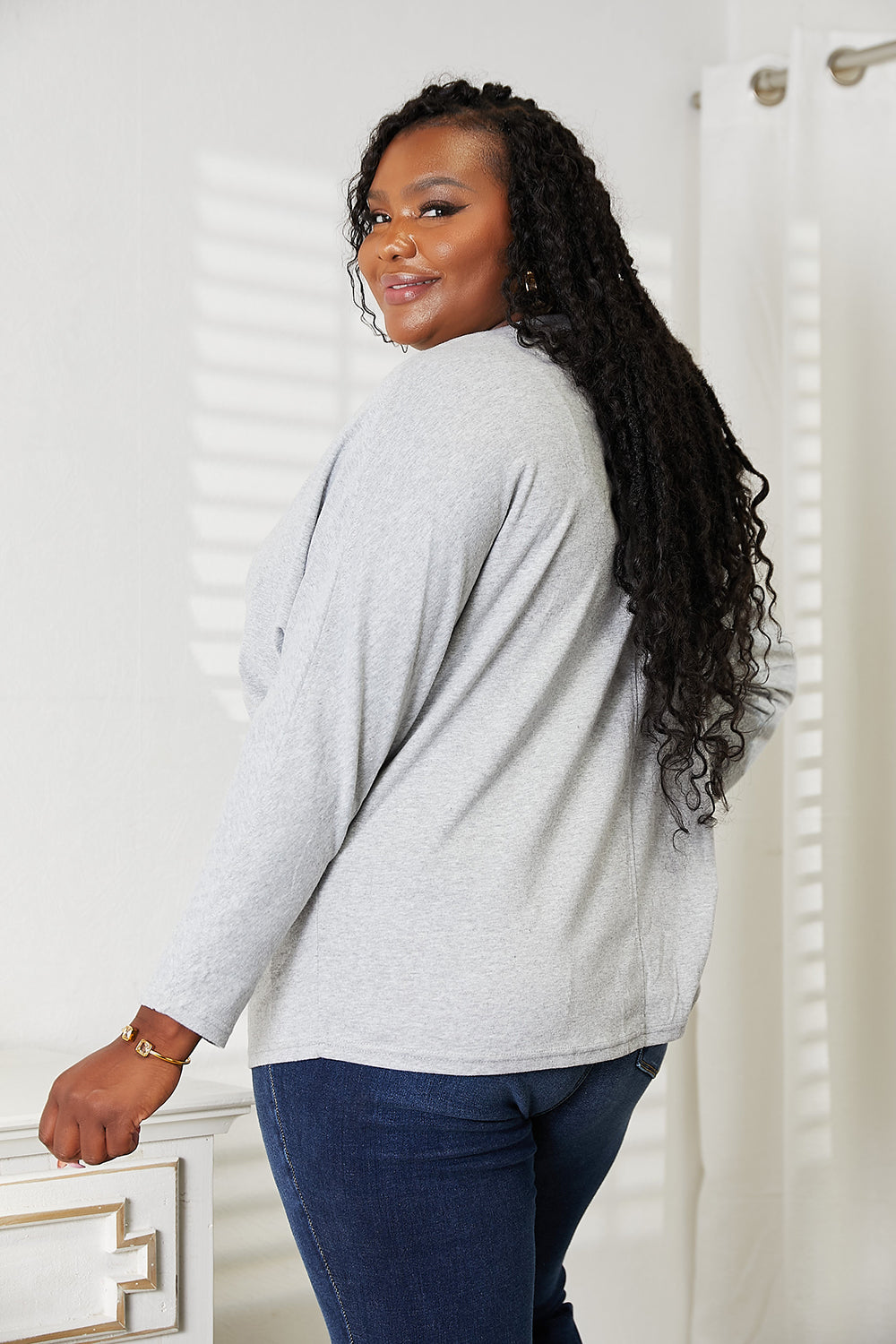 Double Take Seam Detail Round Neck Long Sleeve Top in a stylish design, showcasing seam details and a round neckline.