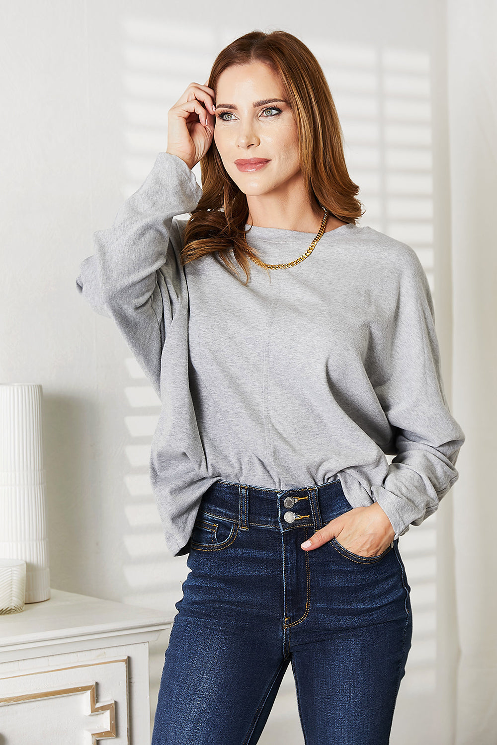 Double Take Seam Detail Round Neck Long Sleeve Top in a stylish design, showcasing seam details and a round neckline.