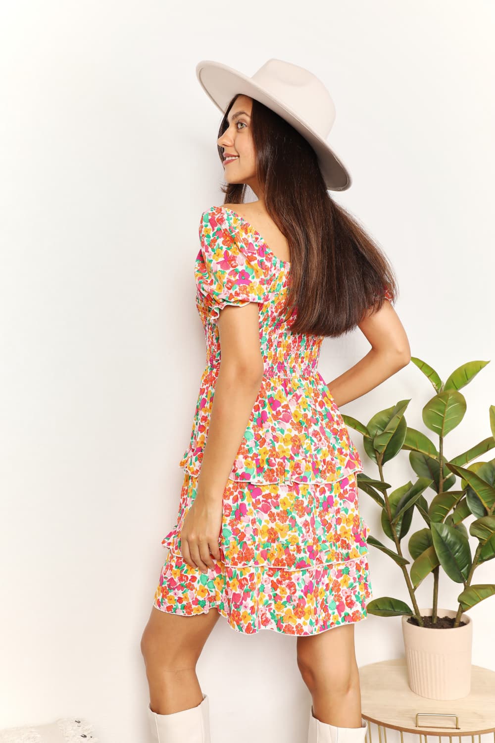 A floral patterned mini dress featuring a sweetheart neckline and flounce sleeves, perfect for casual outings.