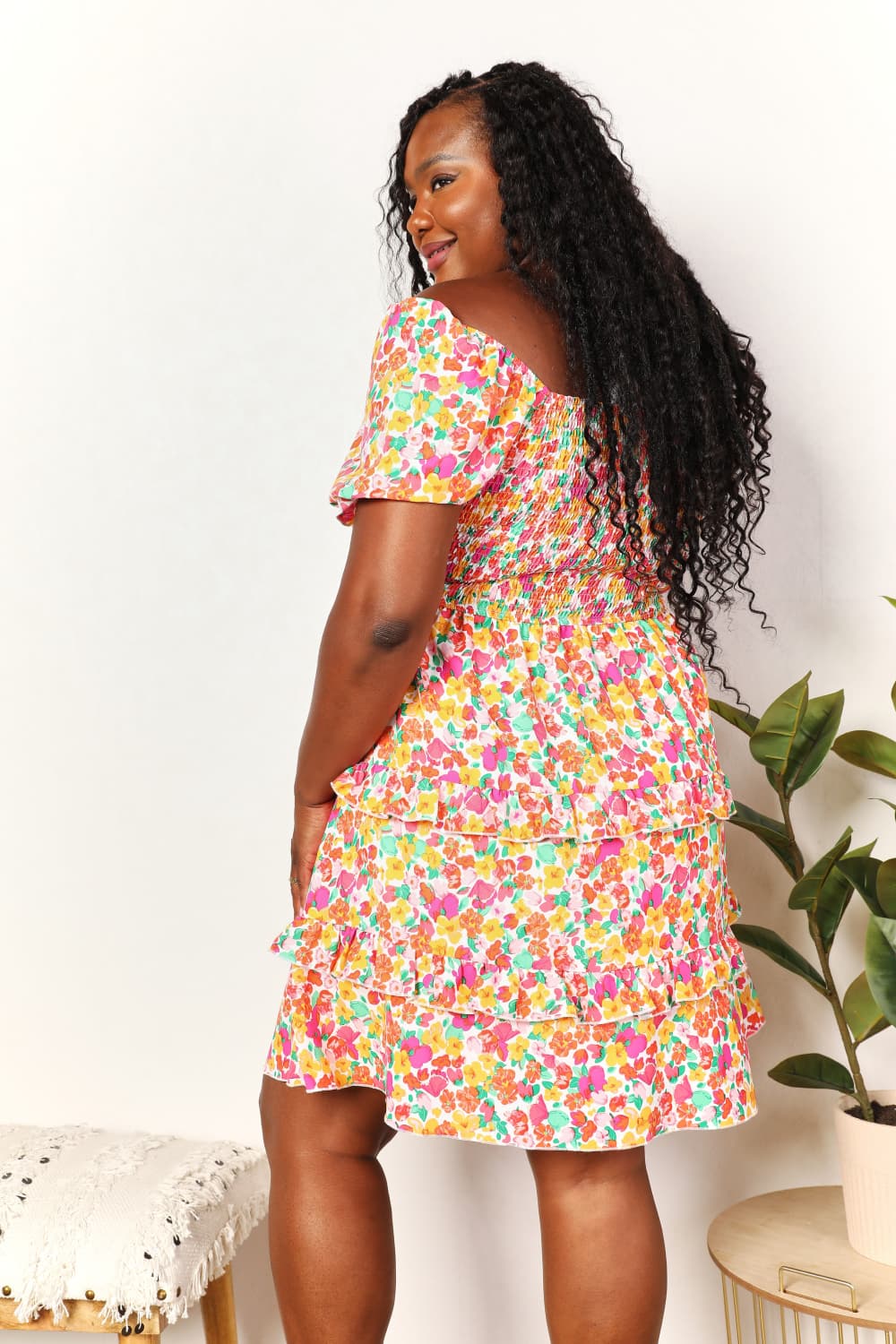 A floral patterned mini dress featuring a sweetheart neckline and flounce sleeves, perfect for casual outings.