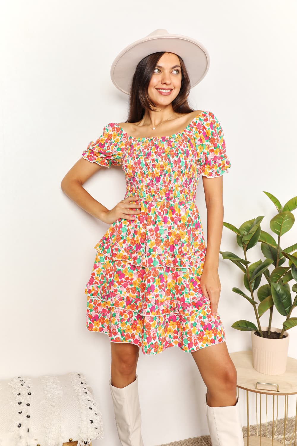 A floral patterned mini dress featuring a sweetheart neckline and flounce sleeves, perfect for casual outings.