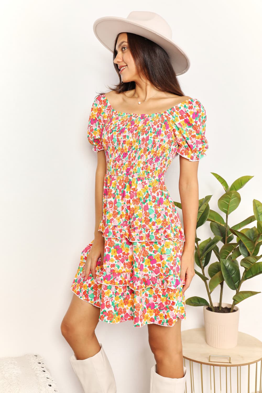 A floral patterned mini dress featuring a sweetheart neckline and flounce sleeves, perfect for casual outings.