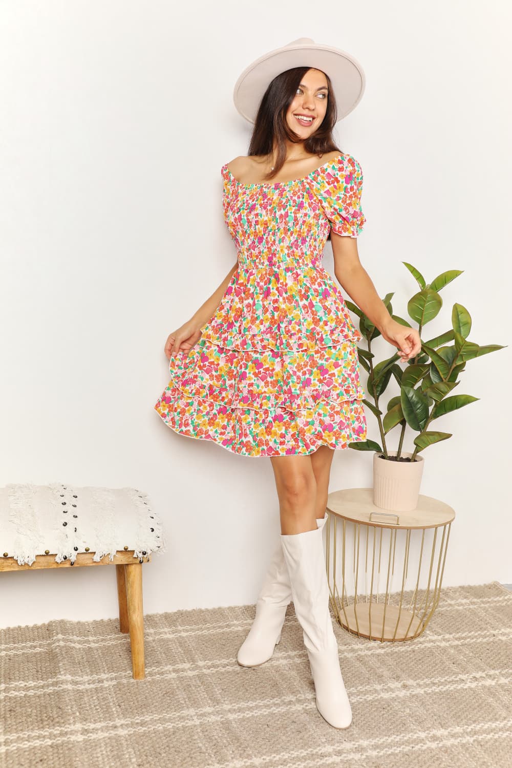 A floral patterned mini dress featuring a sweetheart neckline and flounce sleeves, perfect for casual outings.