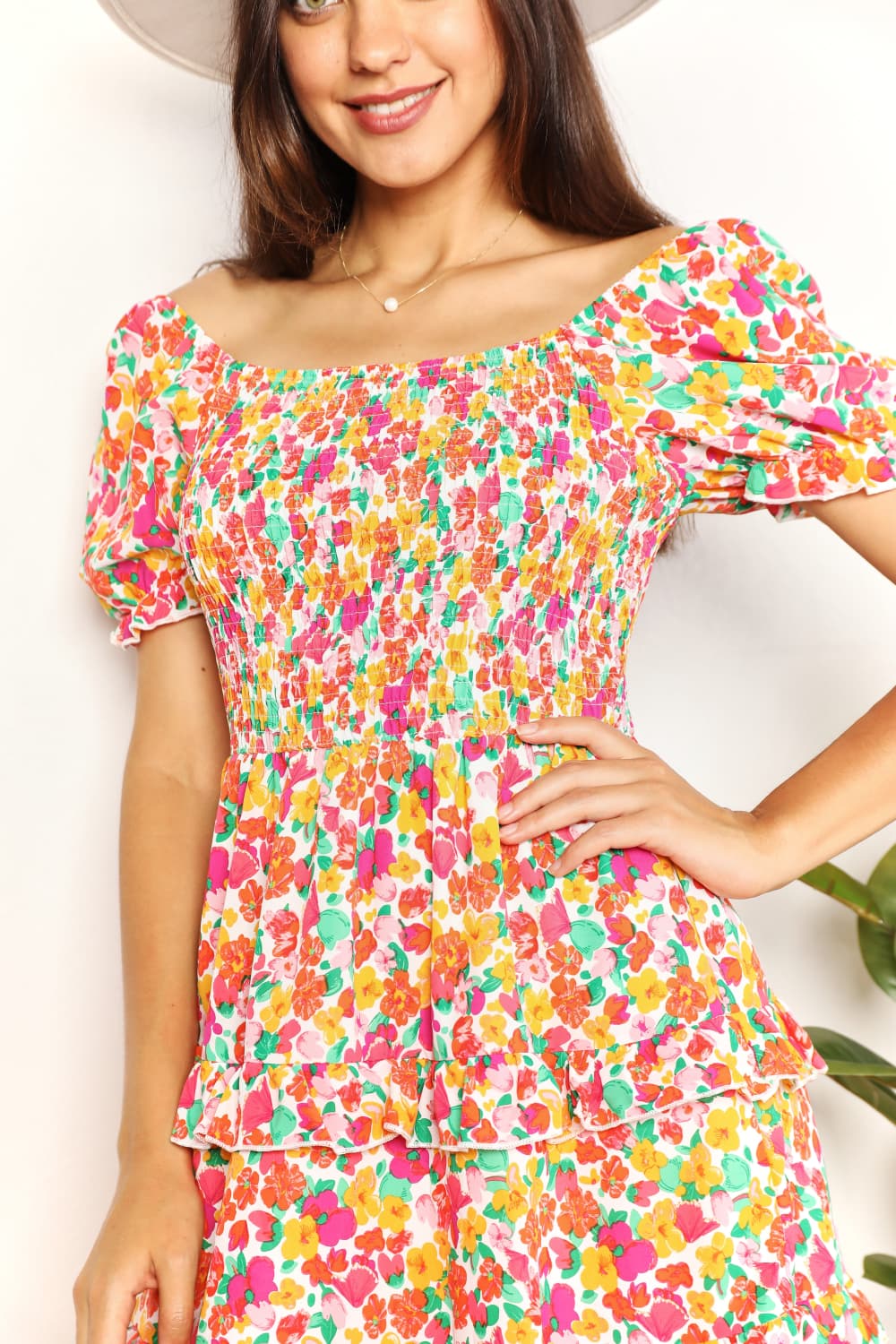 A floral patterned mini dress featuring a sweetheart neckline and flounce sleeves, perfect for casual outings.