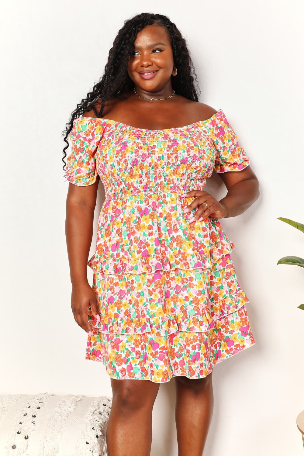 A floral patterned mini dress featuring a sweetheart neckline and flounce sleeves, perfect for casual outings.