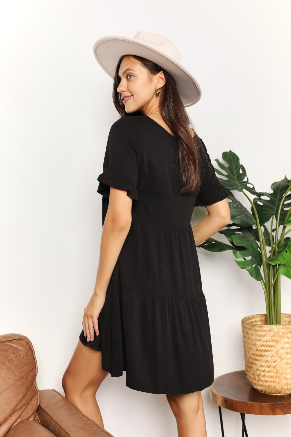 A stylish Double Take V-Neck Flounce Sleeve Tiered Dress featuring a flattering V-neckline and playful flounce sleeves, perfect for various occasions.