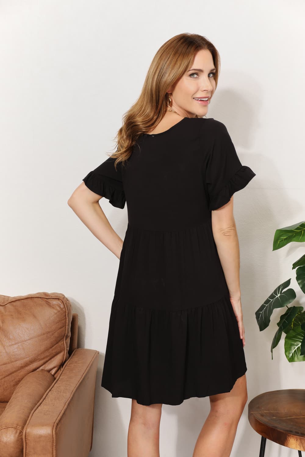 A stylish Double Take V-Neck Flounce Sleeve Tiered Dress featuring a flattering V-neckline and playful flounce sleeves, perfect for various occasions.