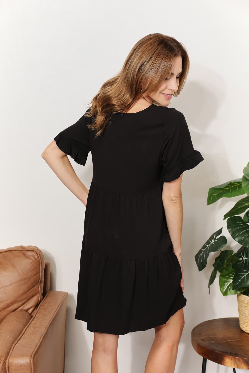 A stylish Double Take V-Neck Flounce Sleeve Tiered Dress featuring a flattering V-neckline and playful flounce sleeves, perfect for various occasions.