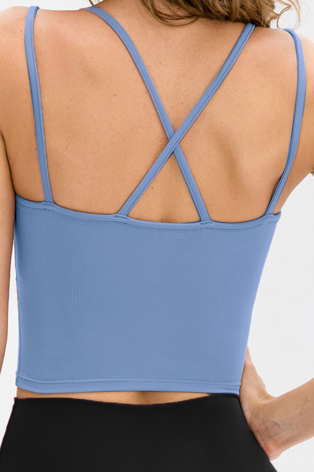 Double-Strap Cropped Yoga Cami in solid color with crisscross back and removable padding, showcasing its stylish design and flexibility.