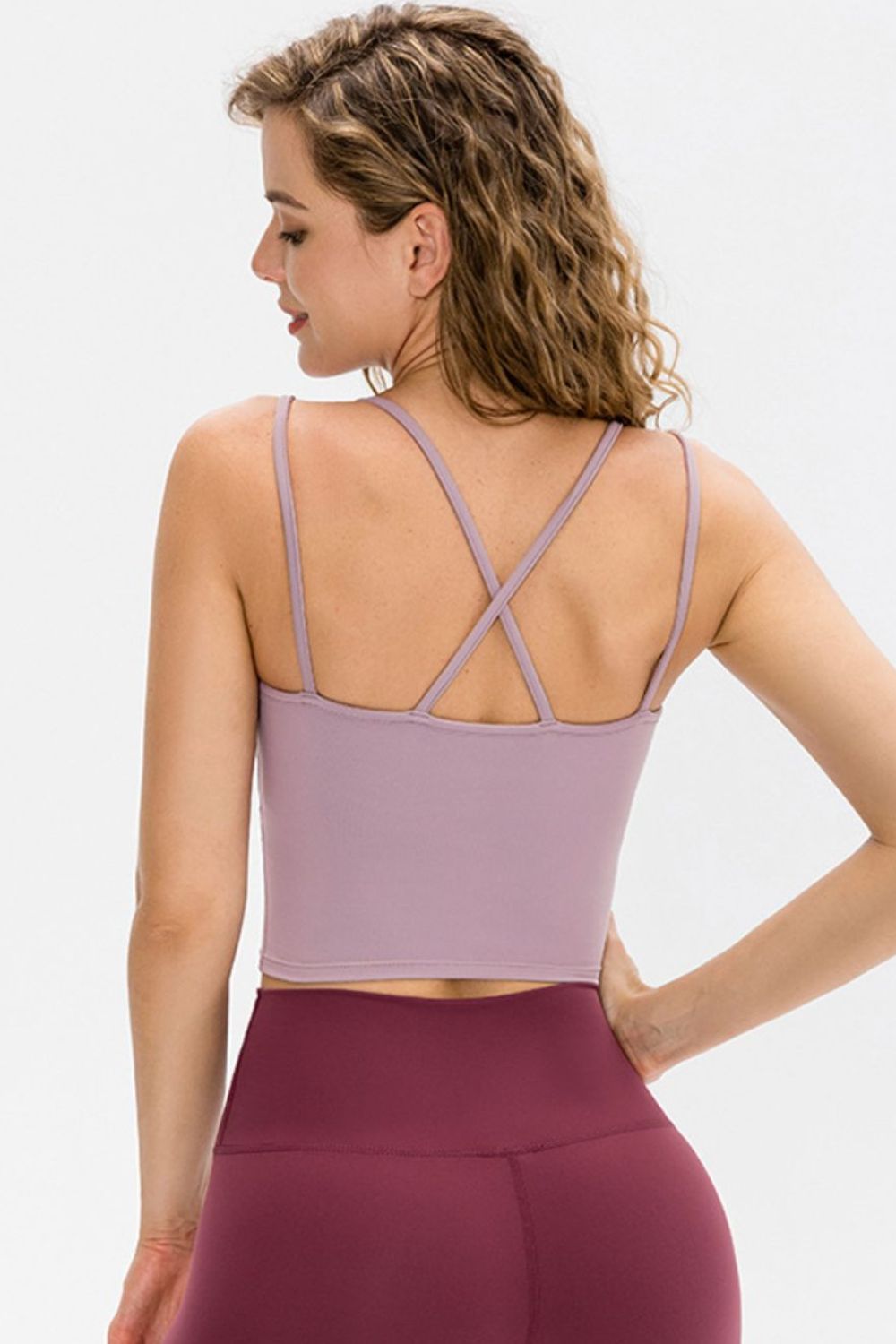 Double-Strap Cropped Yoga Cami in solid color with crisscross back and removable padding, showcasing its stylish design and flexibility.