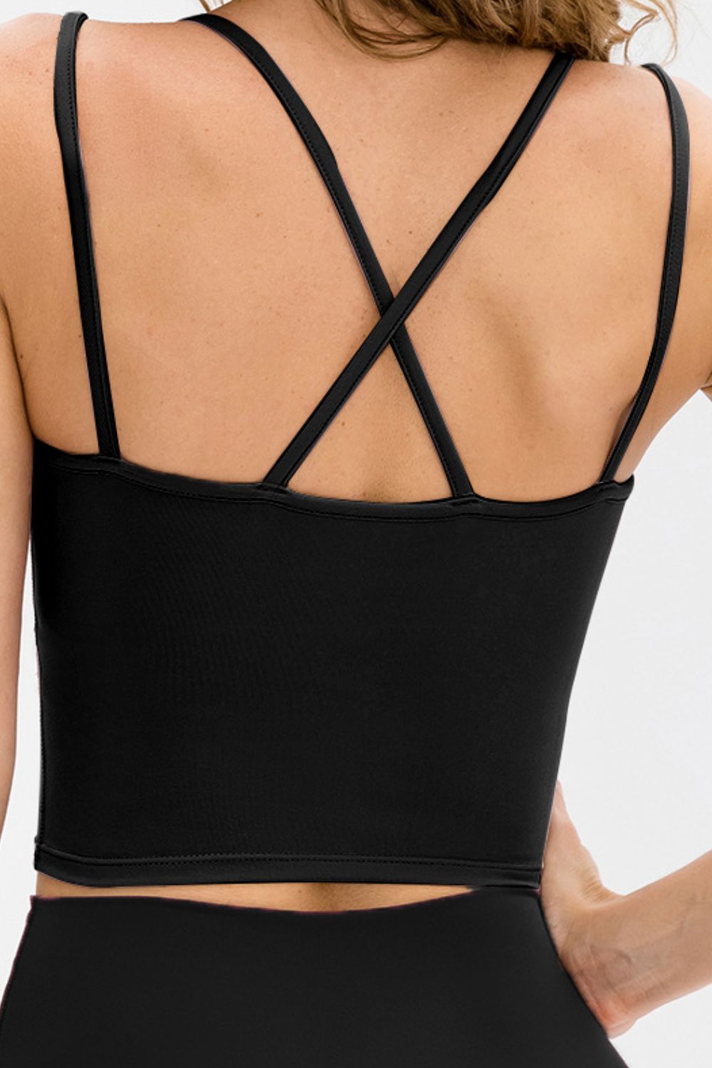 Double-Strap Cropped Yoga Cami in solid color with crisscross back and removable padding, showcasing its stylish design and flexibility.