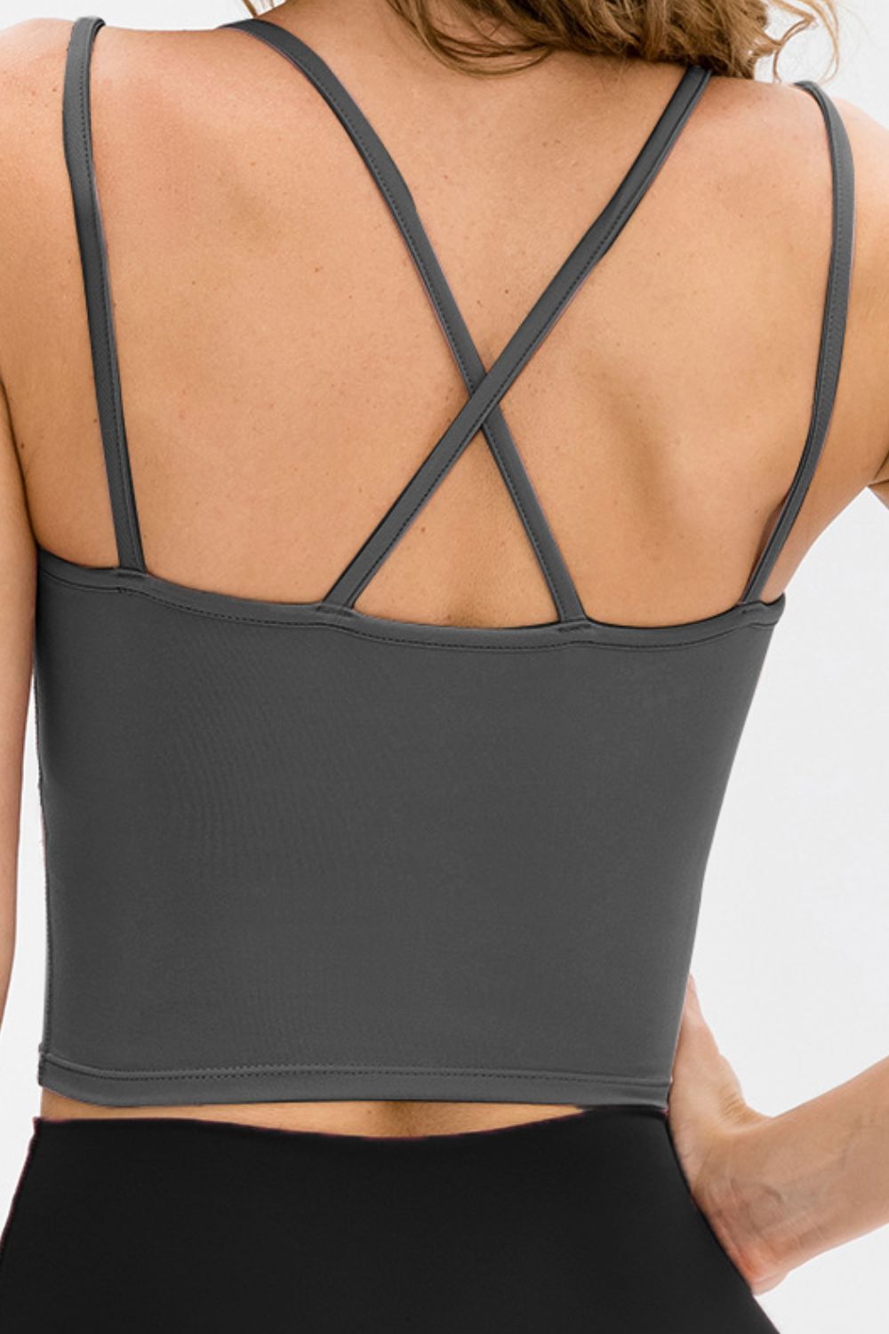 Double-Strap Cropped Yoga Cami in solid color with crisscross back and removable padding, showcasing its stylish design and flexibility.