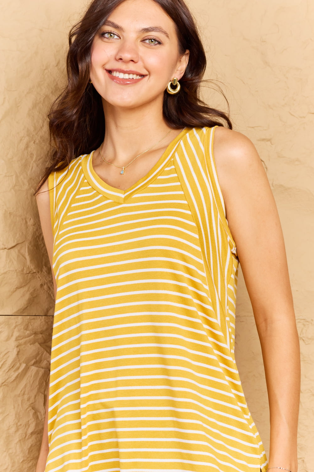 Doublju Talk To Me Full Size Striped Sleeveless V-Neck Top featuring a stylish striped pattern and flattering V-neckline.