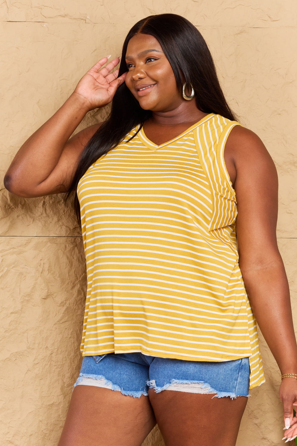 Doublju Talk To Me Full Size Striped Sleeveless V-Neck Top featuring a stylish striped pattern and flattering V-neckline.