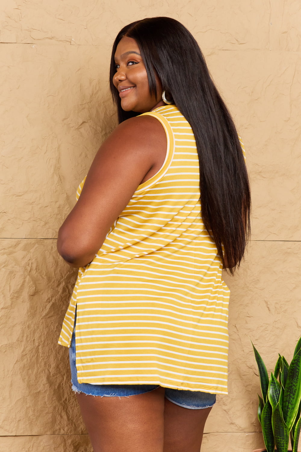 Doublju Talk To Me Full Size Striped Sleeveless V-Neck Top featuring a stylish striped pattern and flattering V-neckline.