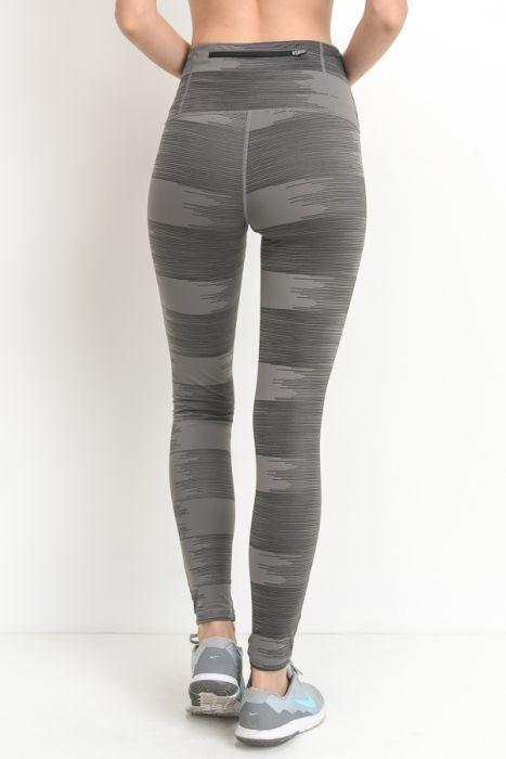 A pair of highwaist leggings featuring a drawn lines print in grey on a lighter grey background, showcasing a stylish and chic design.