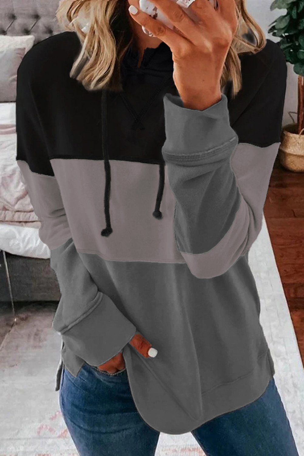 A stylish drawstring hoodie featuring a color block design with pastel stripes, perfect for casual wear.