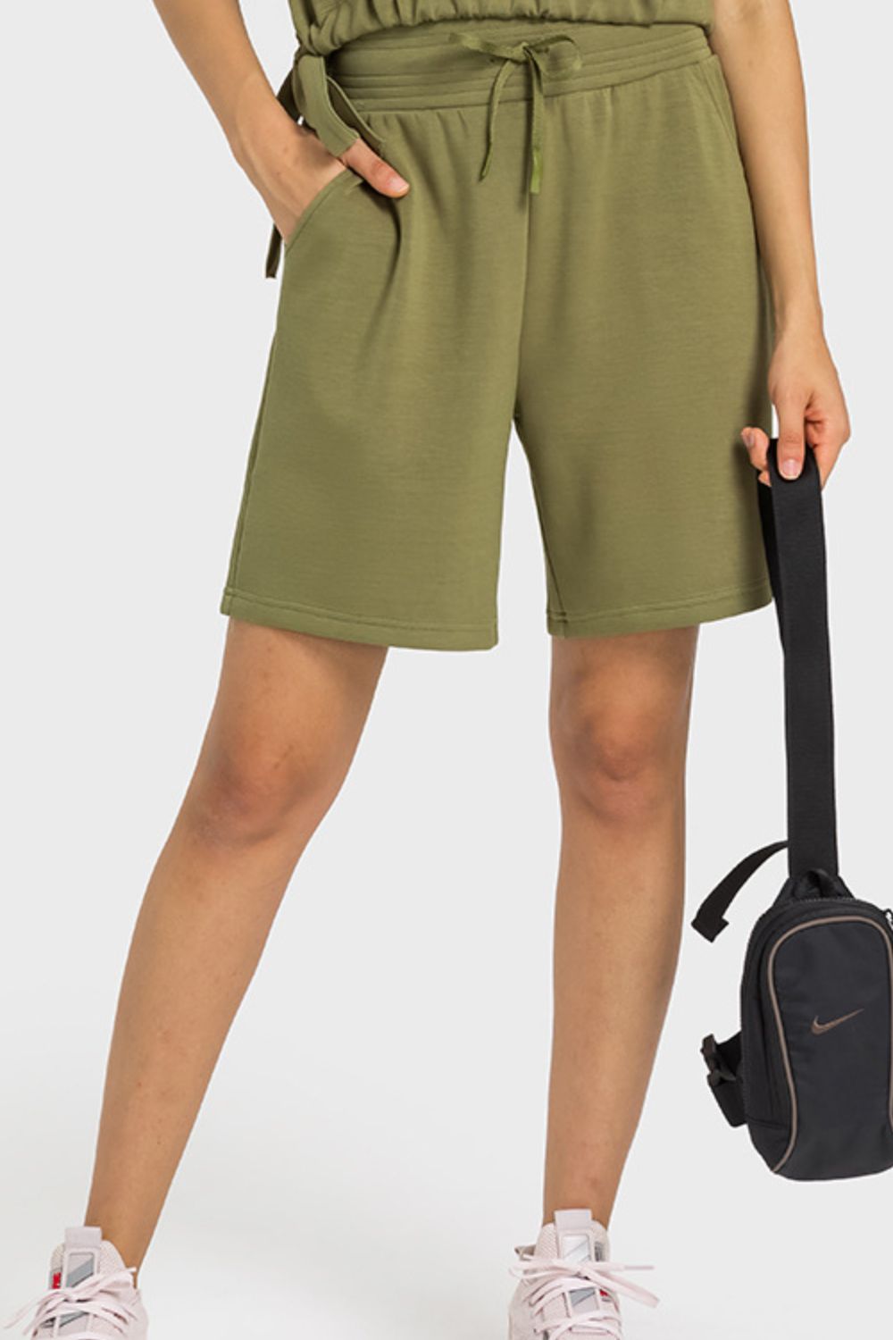 A pair of Drawstring Elastic Waist Sports Bermuda Shorts in solid color, showcasing the elastic waistband and soft fabric.