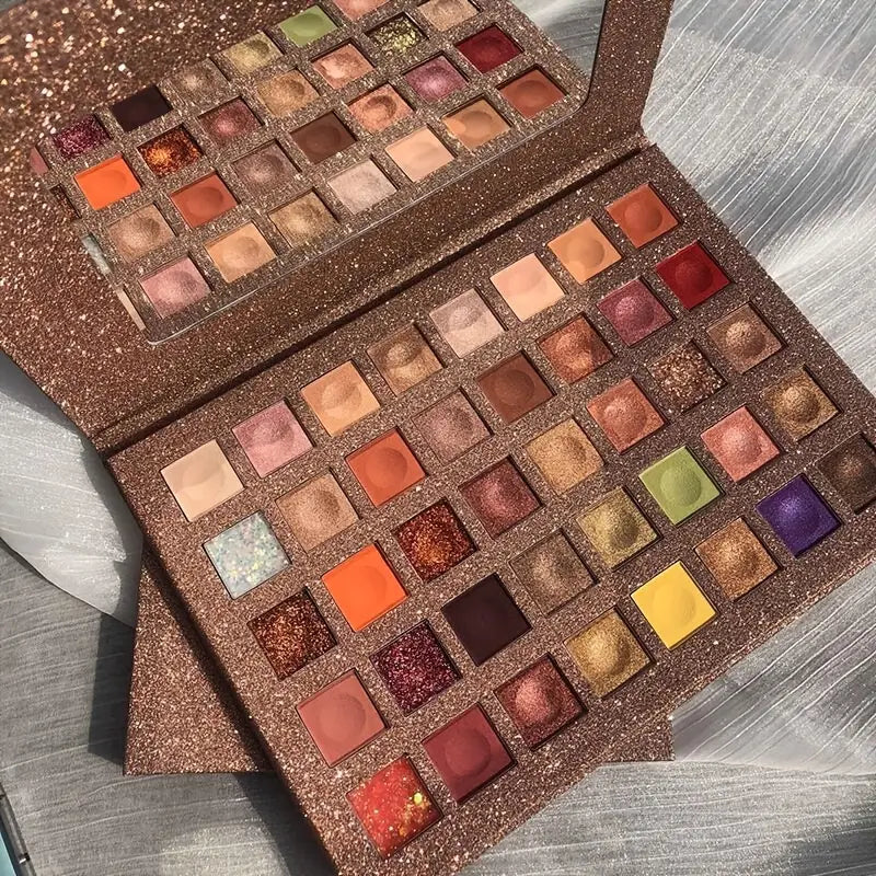 Dreamy 40 Color Eyeshadow Palette showcasing vibrant shades and glitter sequin eyeshadows in a sleek design with a mirror.