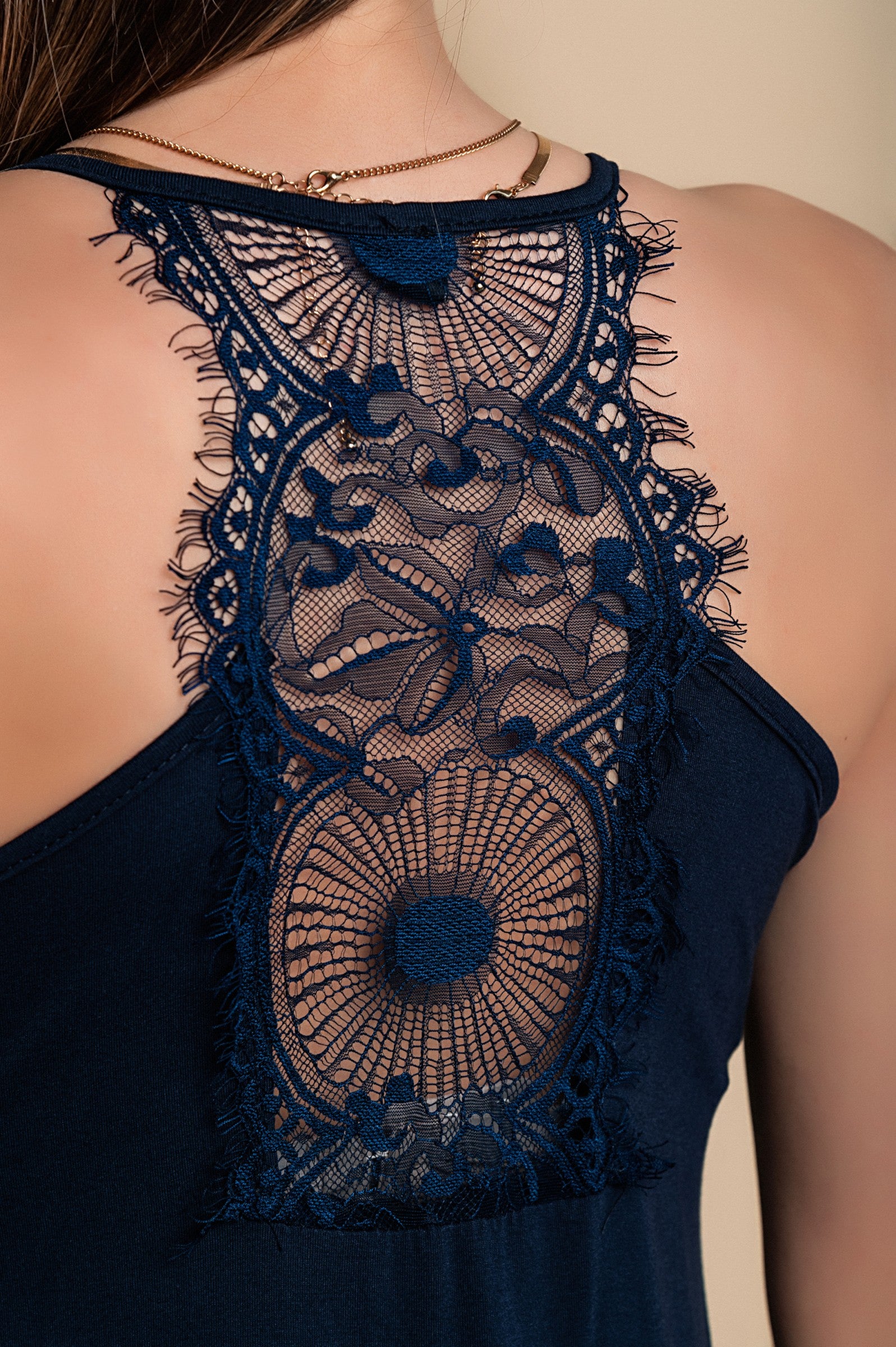 Elegant dark blue DRESS PRIMAROSA featuring lace details, 'V' neck, and thin straps, perfect for sophisticated occasions.