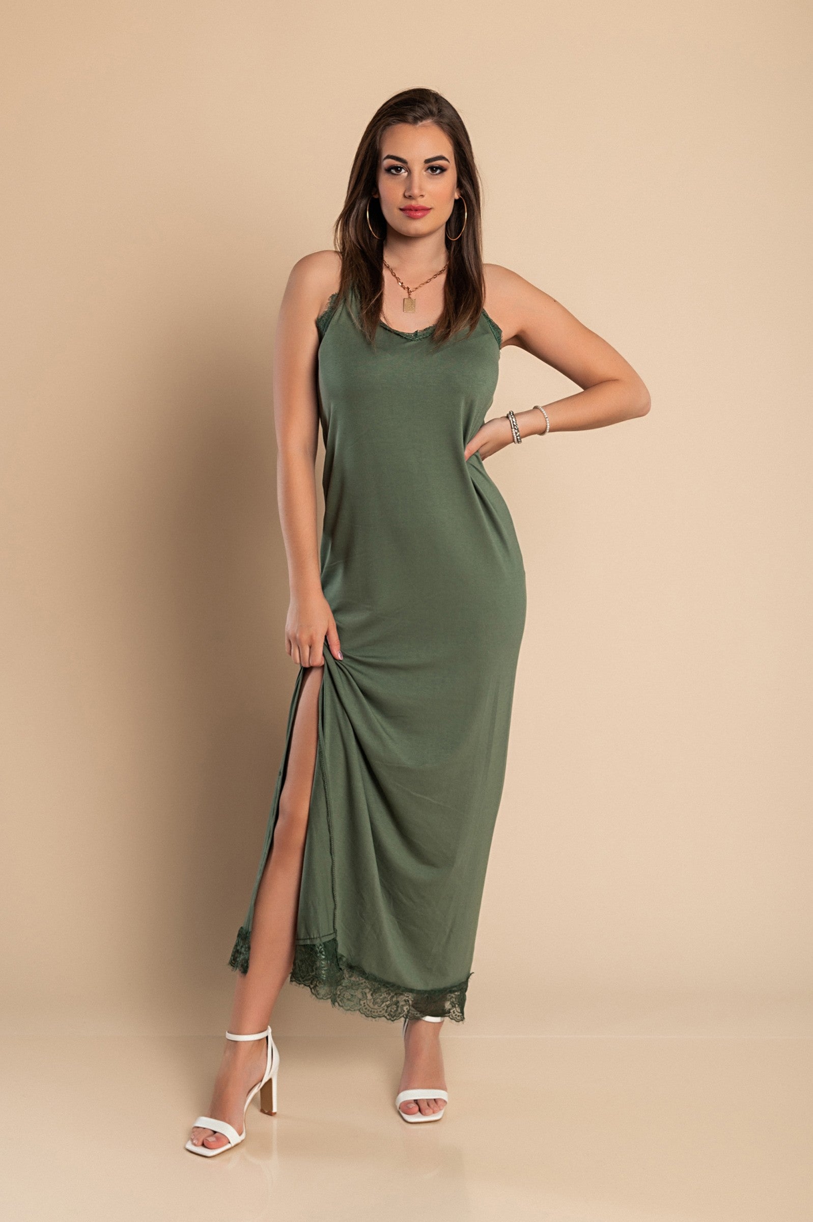 Elegant olive dress with lace detailing and thin straps, showcasing a sophisticated design.