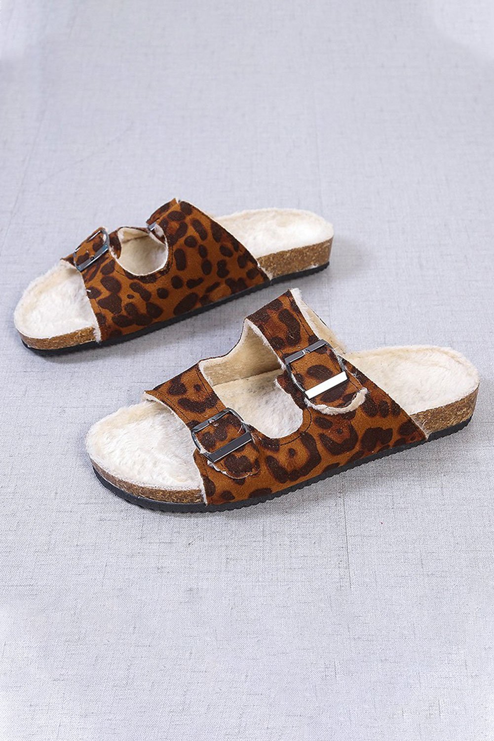 D-ring Buckled Plush Slippers in soft material, showcasing stylish design and comfortable fit.